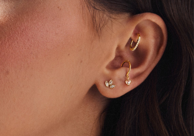 Model with three ear piercings.