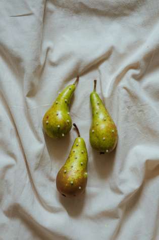 Three pears studded with small pearls.