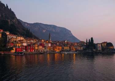 Lake como town at sunset .