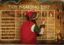 Elf writing on the toy making list.