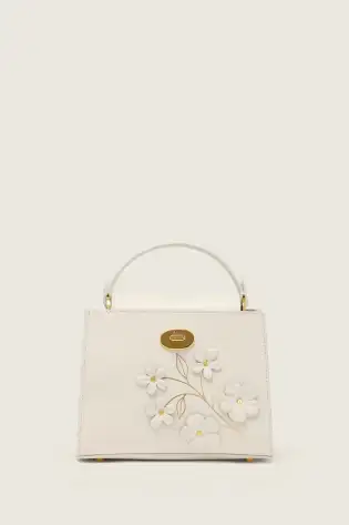 Cream handbag with flowers.