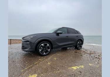 Exterior view of car by water's edge.