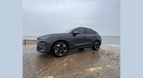 Exterior view of car by water's edge.