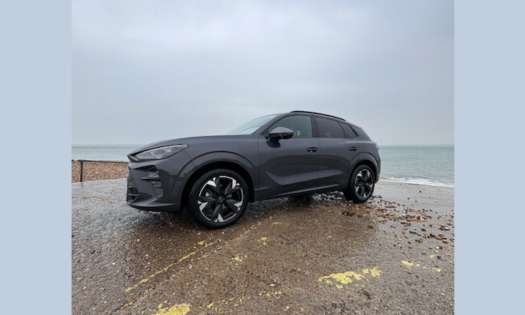 Exterior view of car by water's edge.