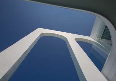 View of villa pillars and blue sky .