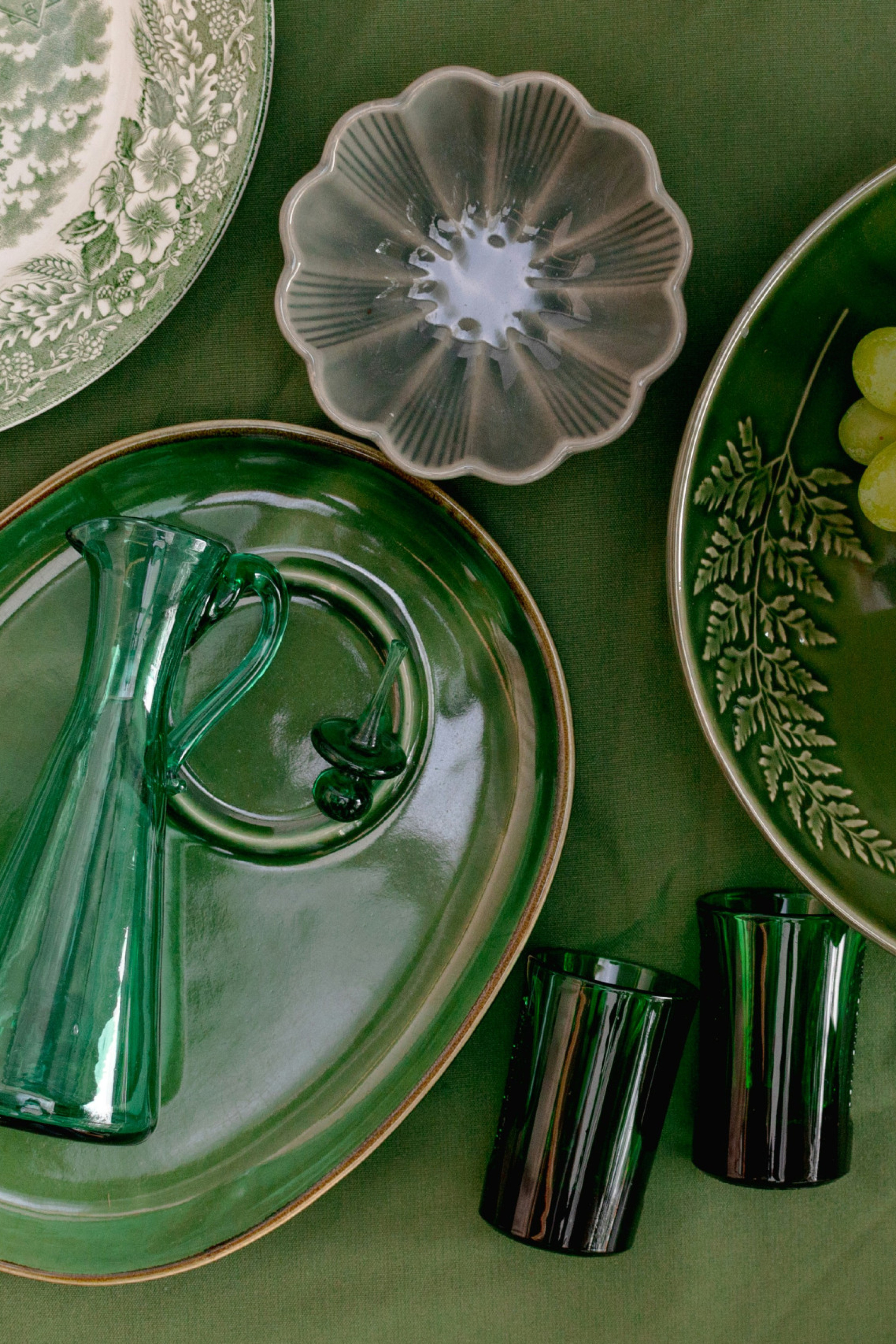 vintage homeware on green tablecloth