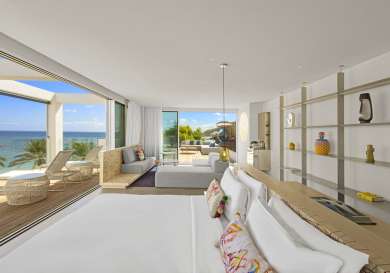 Ibiza hotel room with lounge area and terrace.