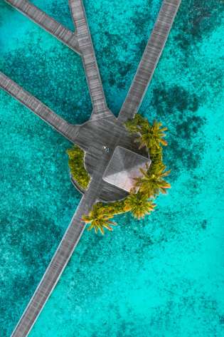 Aerial view of jetty at W Maldives .