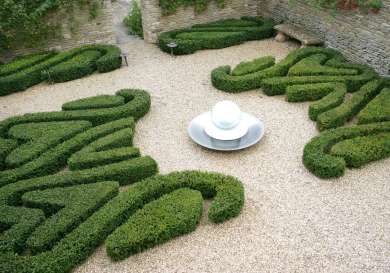 Topiary garden and water feature at hotel .