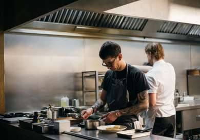 Chefs working in a kitchen.