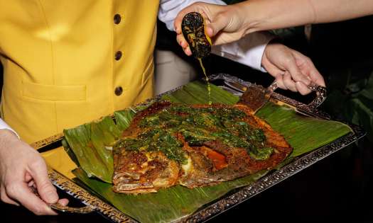 Whole roasted turbot on a silver tray.