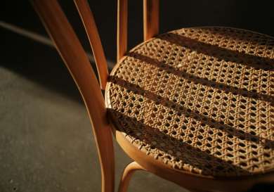 Wicker chair in the sunlight.