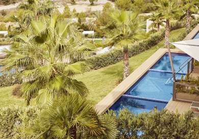 Aerial view of private hotel pools and verandas.