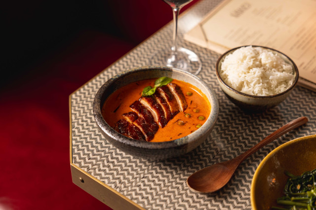 meat dish served at restaurant table with rice 