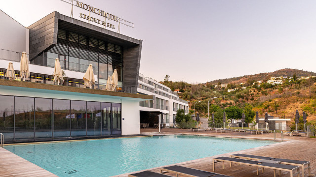 monchique resort & spa pool area with sunbeds surrounding it