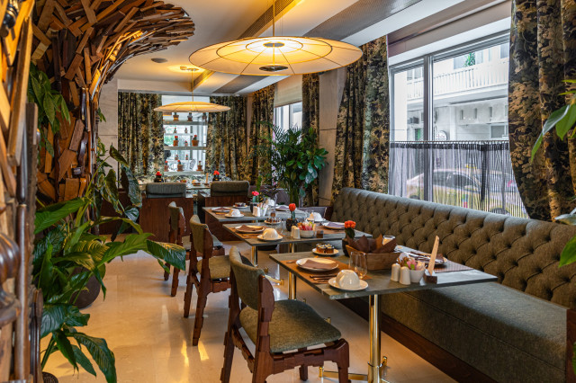 restaurant inside hotel with tables and chairs