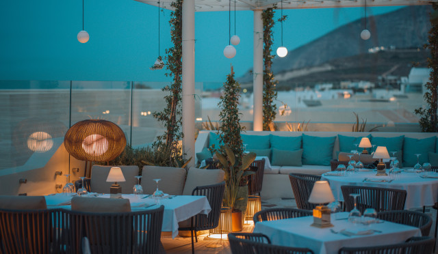 hotel restaurant with wicker chairs and banquette seating