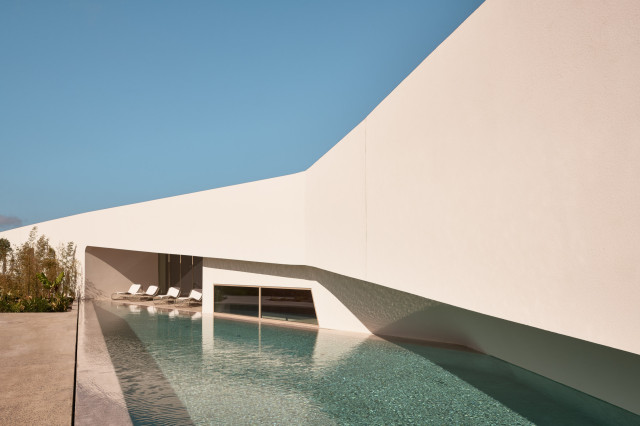 pool next to modern hotel 