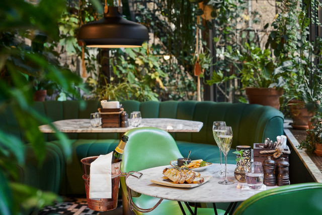 restaurant at hotel with green seating 