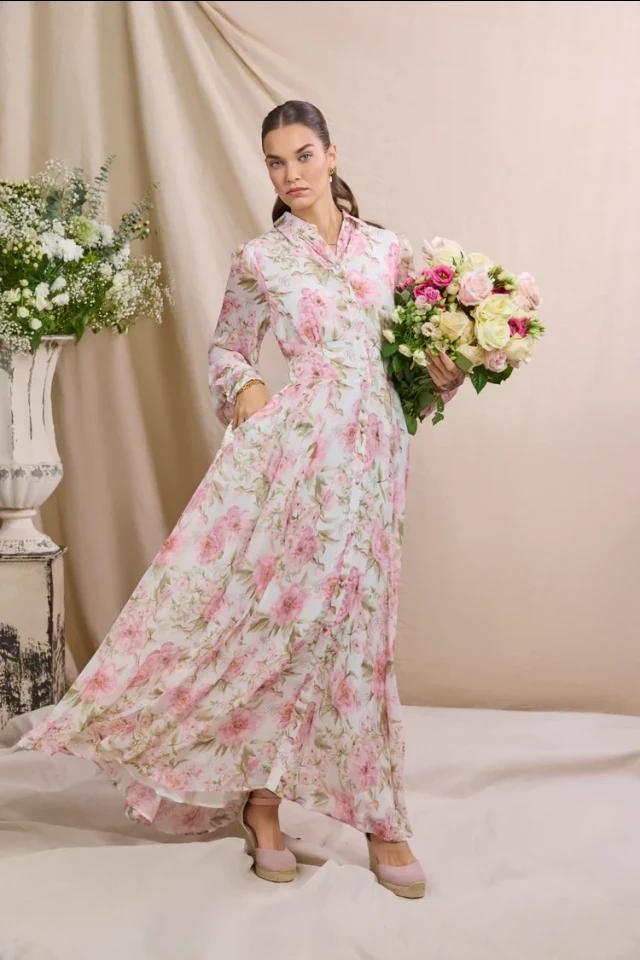 model wearing pink and white holland cooper summer dress