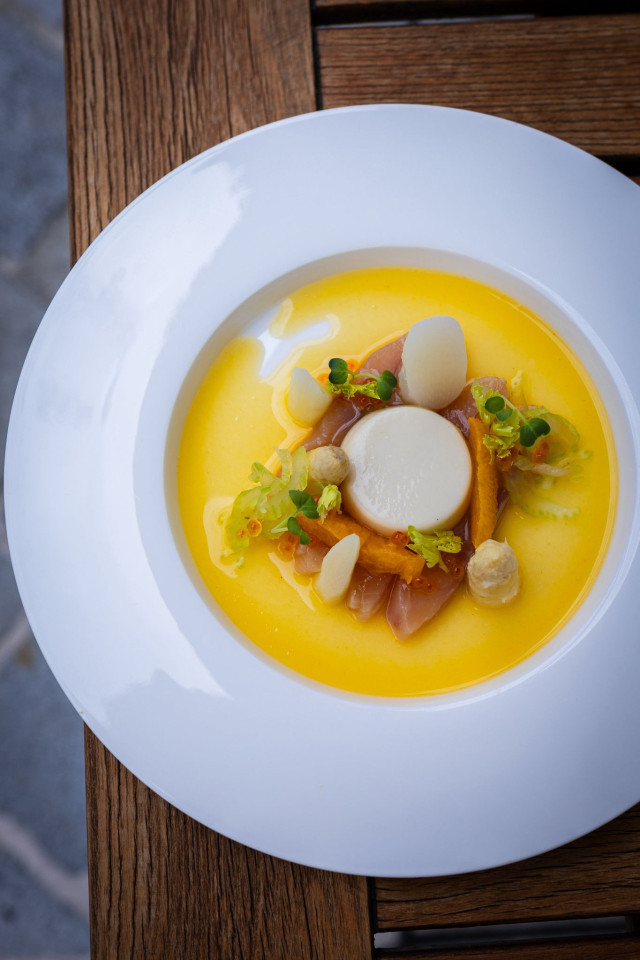 restaurant dish served in yellow sauce 