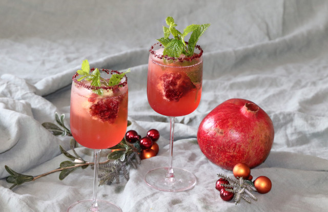 photo of pomegranate spritz cocktail on linen cloth