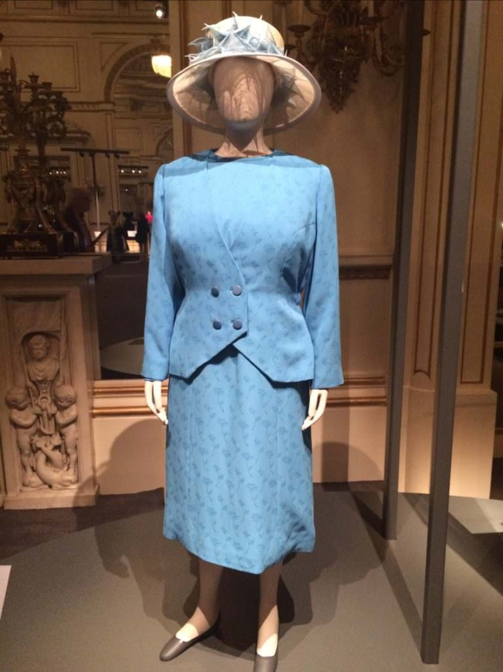 The Queen's blue blazer and matching skirt on mannequin