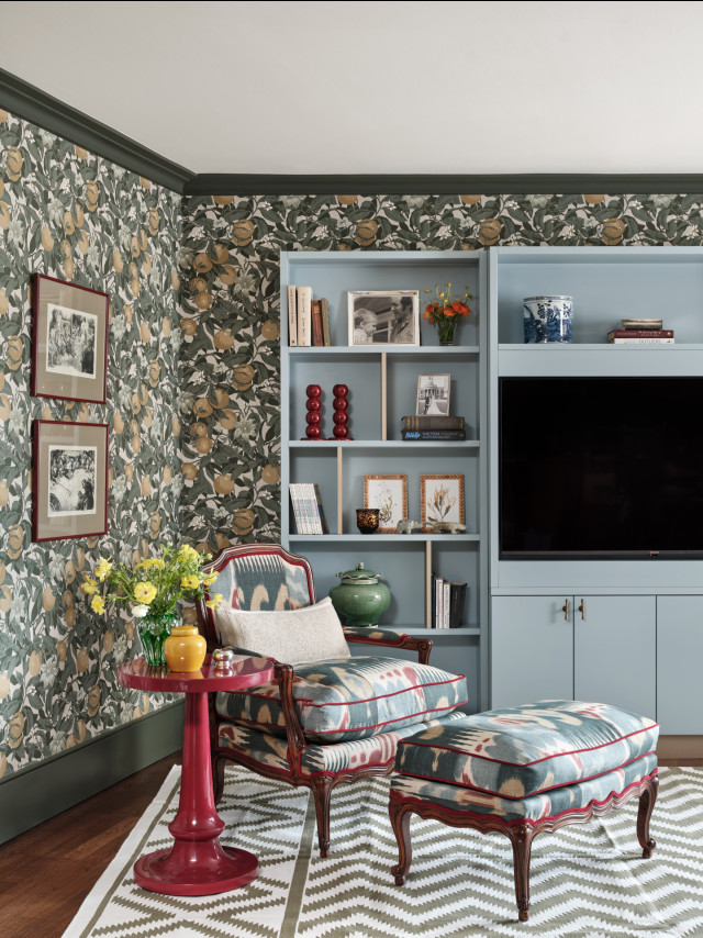 living room interior with fruit wallpaper and pale blue cupboard space