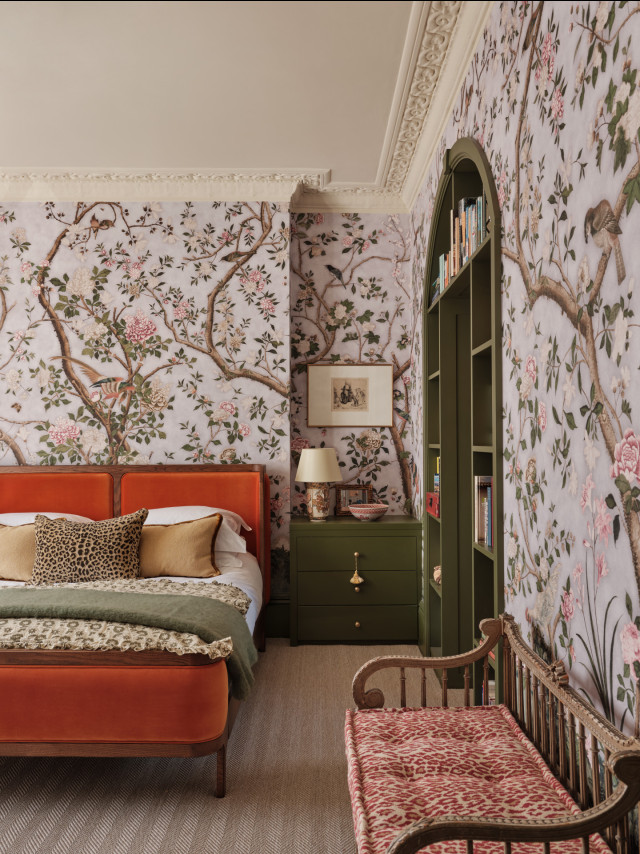 bedroom interior with floral wall and orange velvet bed