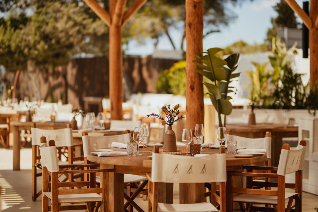wooden tables at nikki beach club in Ibiza