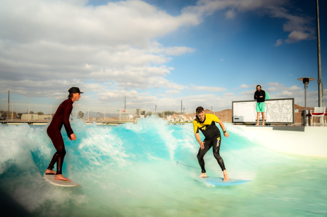 photo of two people surfing at surf park in Phoenix 