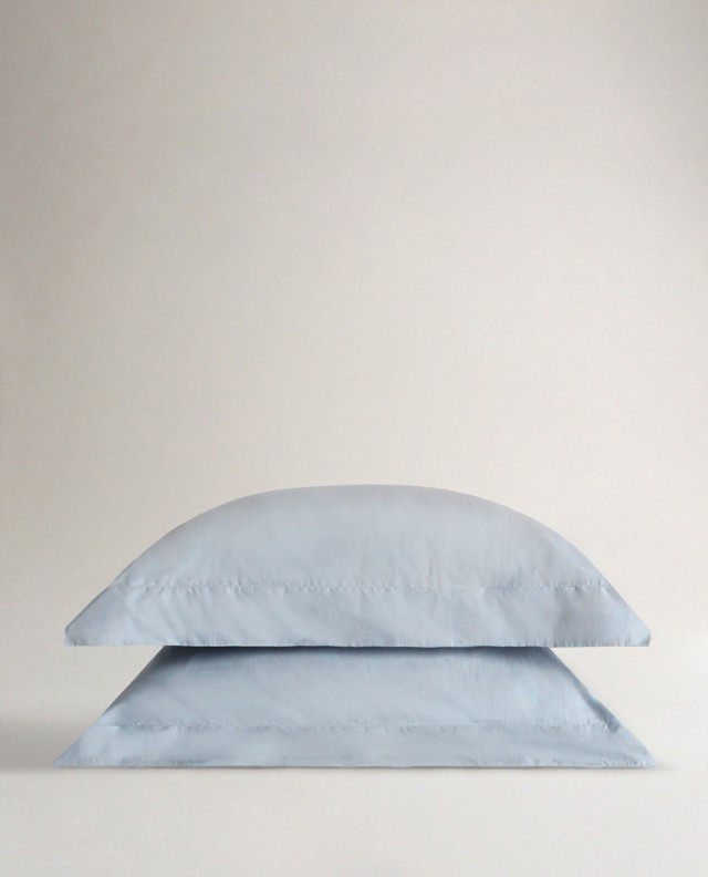 two pale blue pillowcases