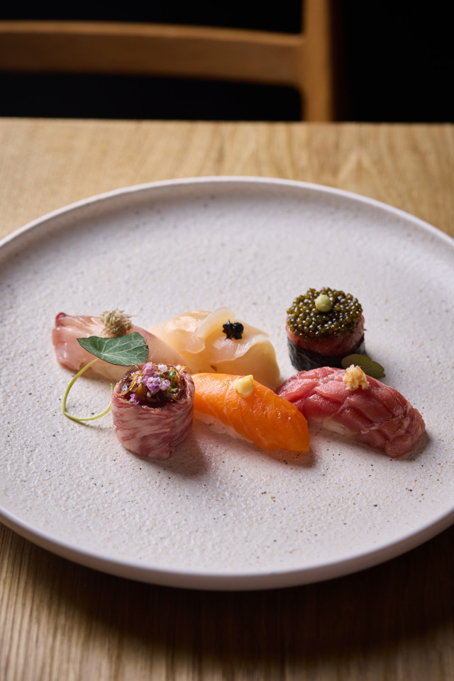 fresh sushi on a white plate 