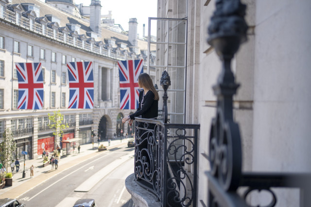 person standing on balcony at hotel cafe royal