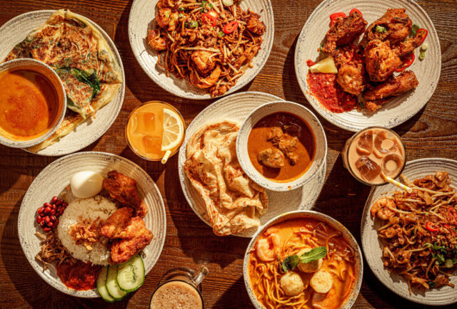spread of roti king food on wooden table