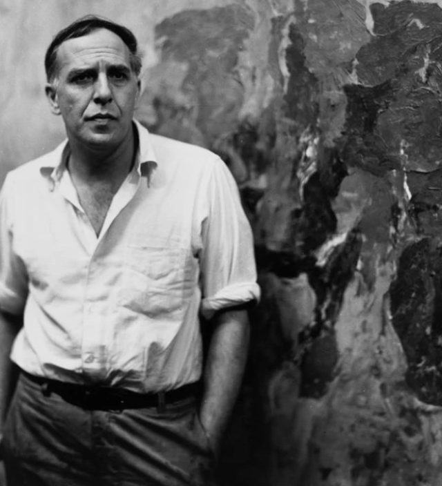 PHILIP GUSTON PHOTOGRAPHED IN HIS STUDIO, 1957. PHOTO © ARTHUR SWOGER / COLLECTION HELD BY CAROL R. SCOTT. ART © THE ESTATE OF PHILIP GUSTON, COURTESY HAUSER & WIRTH