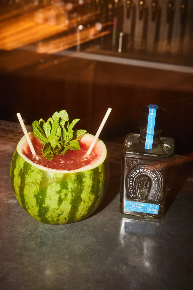 watermelon cocktail with a bottle of tequila
