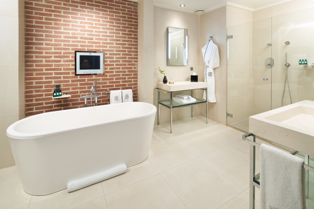 bathroom inside amsterdam hotel with bath tub and shower