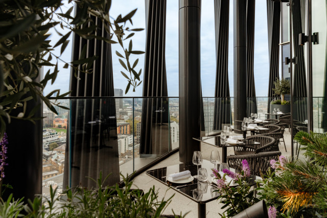 restaurant balcony area with tables and chairs