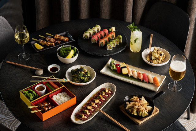 photo of sushi and other dishes at sticks & sushi 