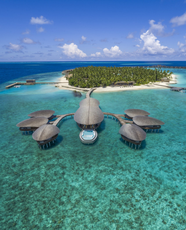 st regis maldives hotel's overwater spa in the shape of a lobster 