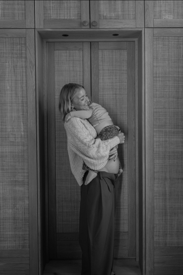 hermione olivia hugging her child
