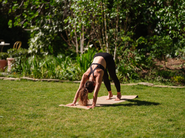 woman doing yoga pose outside