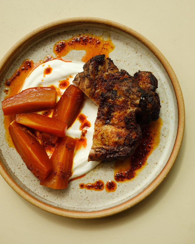 restaurant dish of meat and carrots with white sauce 