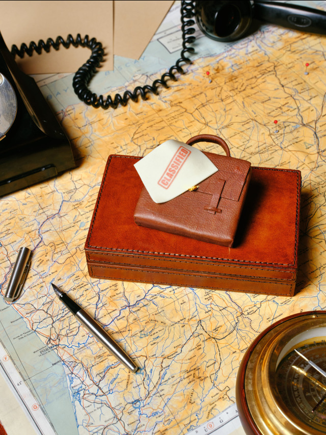 miniature briefcase on map 