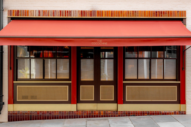 exterior of restaurant with red awning