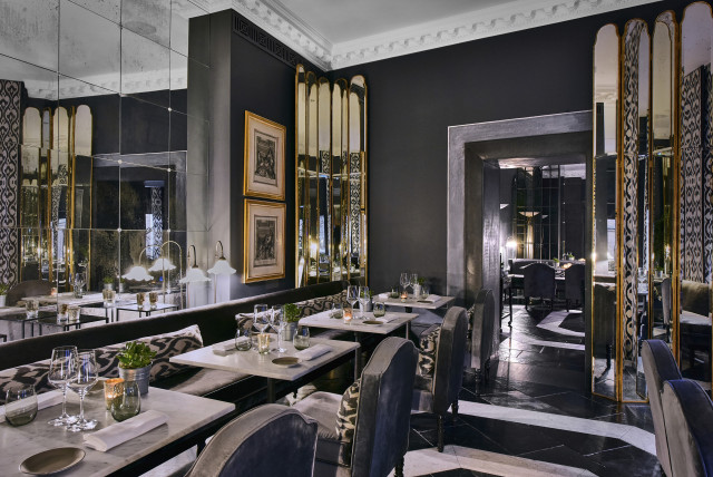 the franklin hotel restaurant with monochromatic accents and lots of mirrors