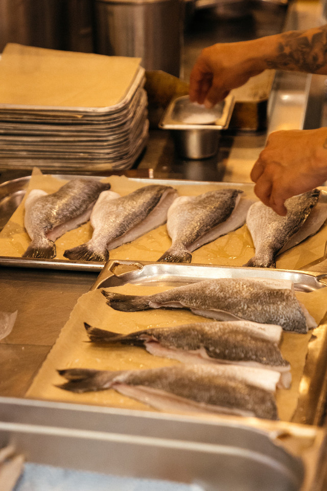 fish being prepared in restaurant