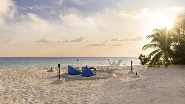 w maldives outdoor dining at sunset 