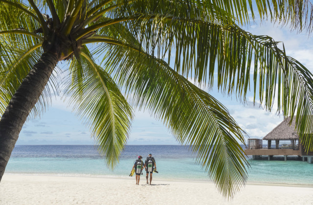 two people enjoying water sports at w maldives